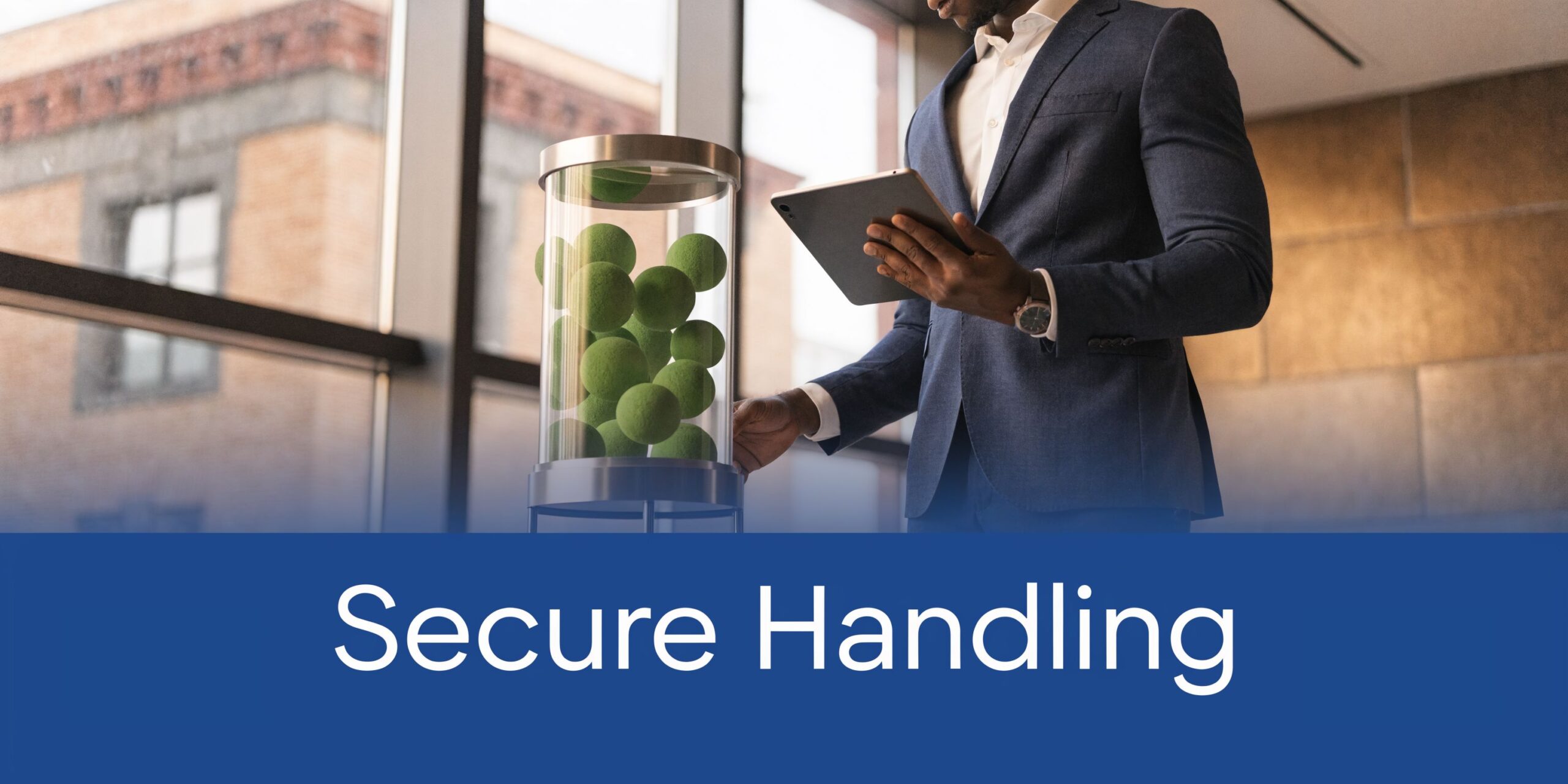 A professional in a business suit holding a tablet next to a glass display of green spheres.