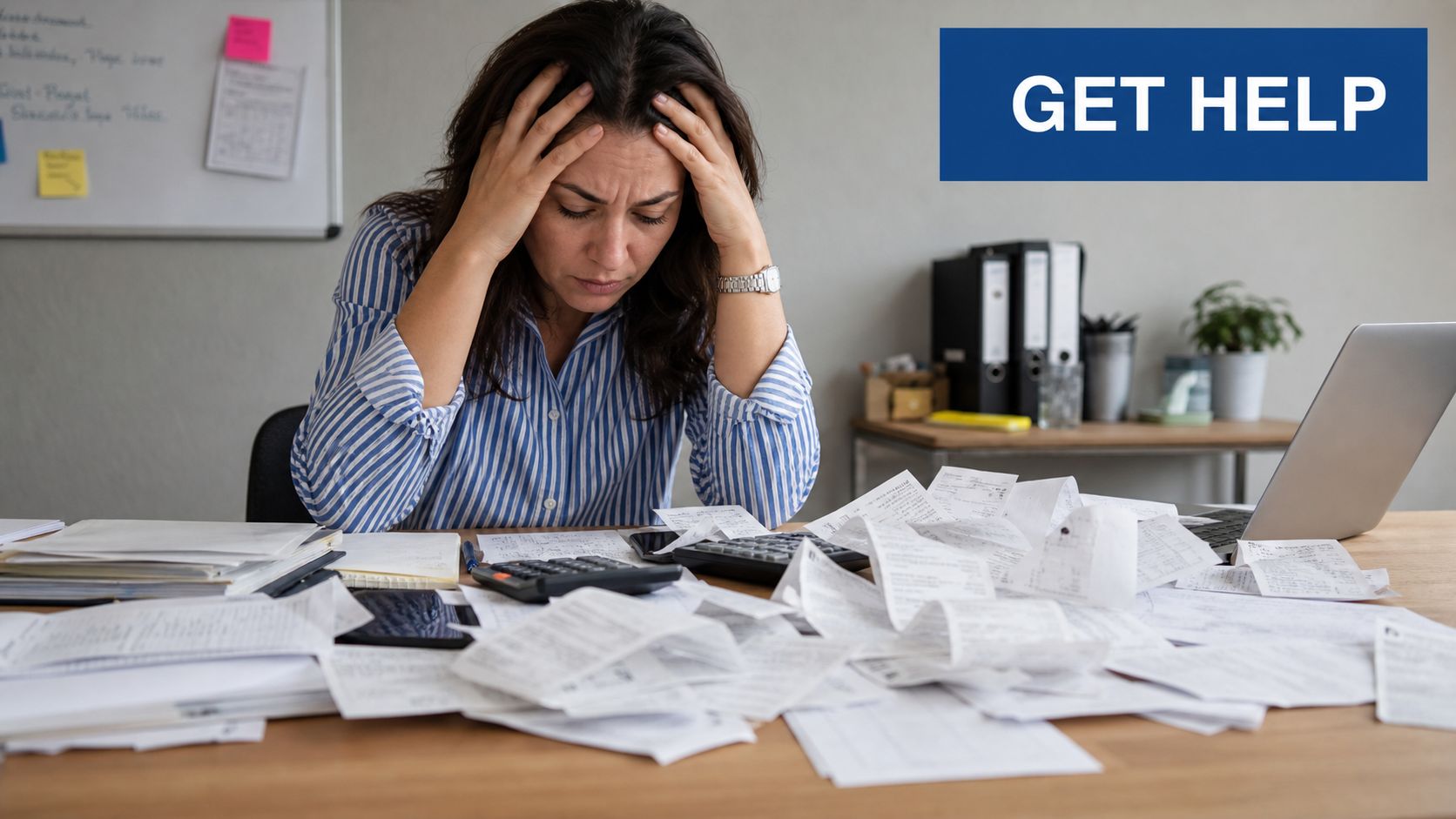 A stressed woman sits at a desk covered in financial receipts and papers, needing small business accounting support.